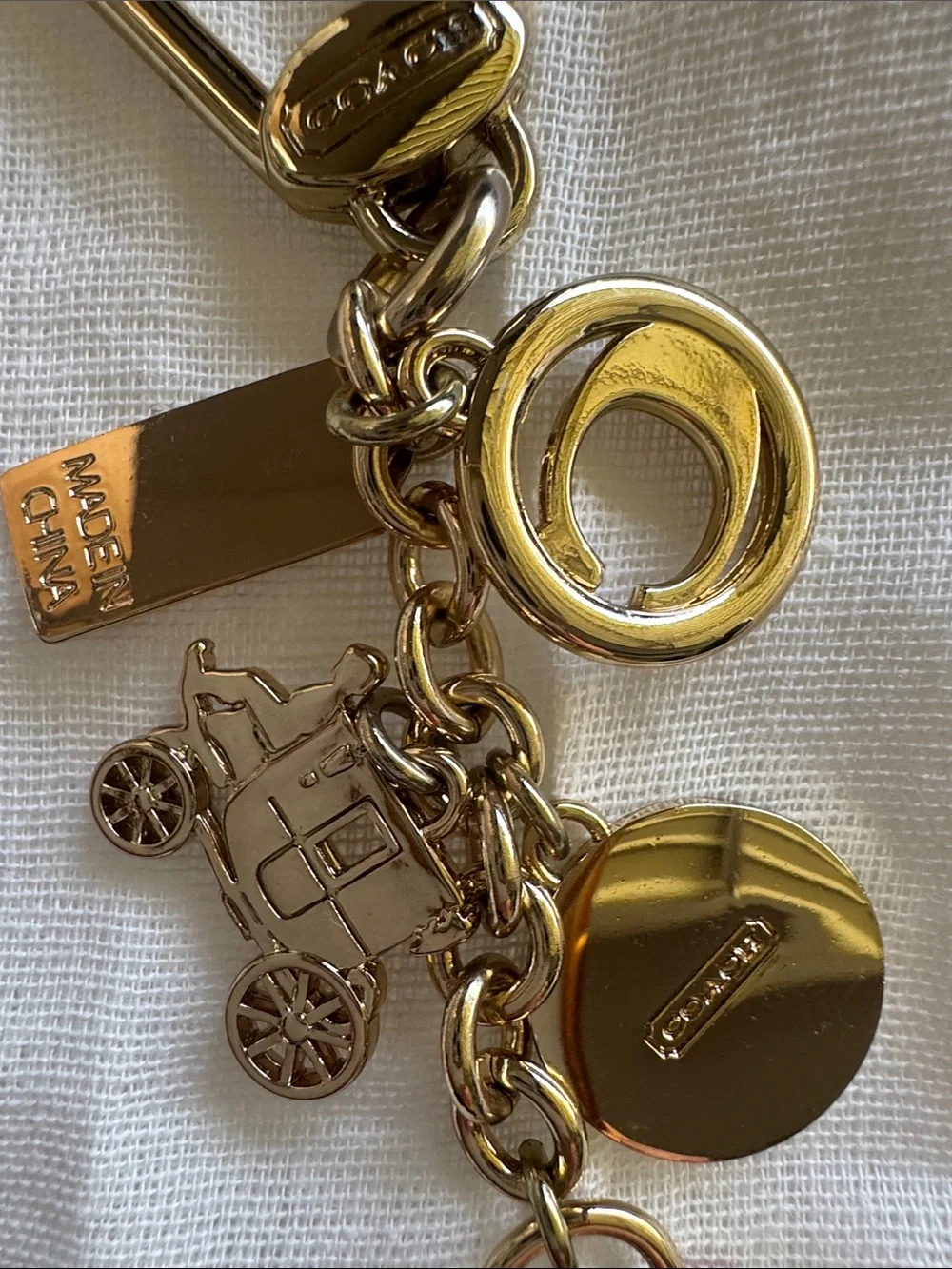 Coach Gold-Tone Multi Charm Keychain with Pink Heart and Red Tag